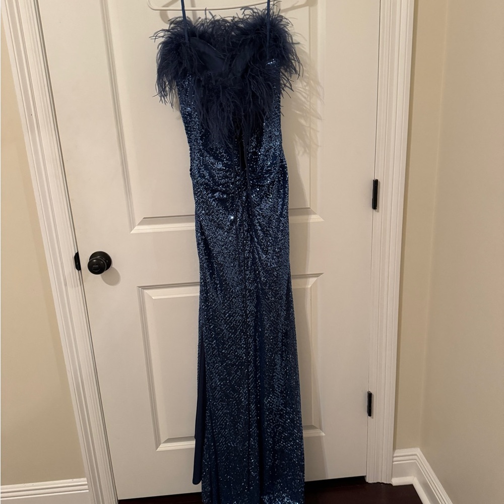 Elegant Blue Sequin Gown with Feather Detail